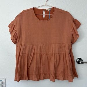 Peach peplum blouse. New with tags.